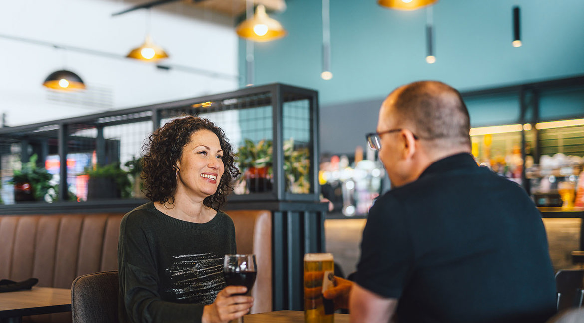 Couple enjoying drinks in The Drift Inn bar and restaurant 