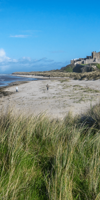 people on Bamburgh Beach