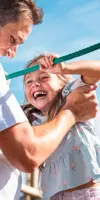 Dad with daughter in play area