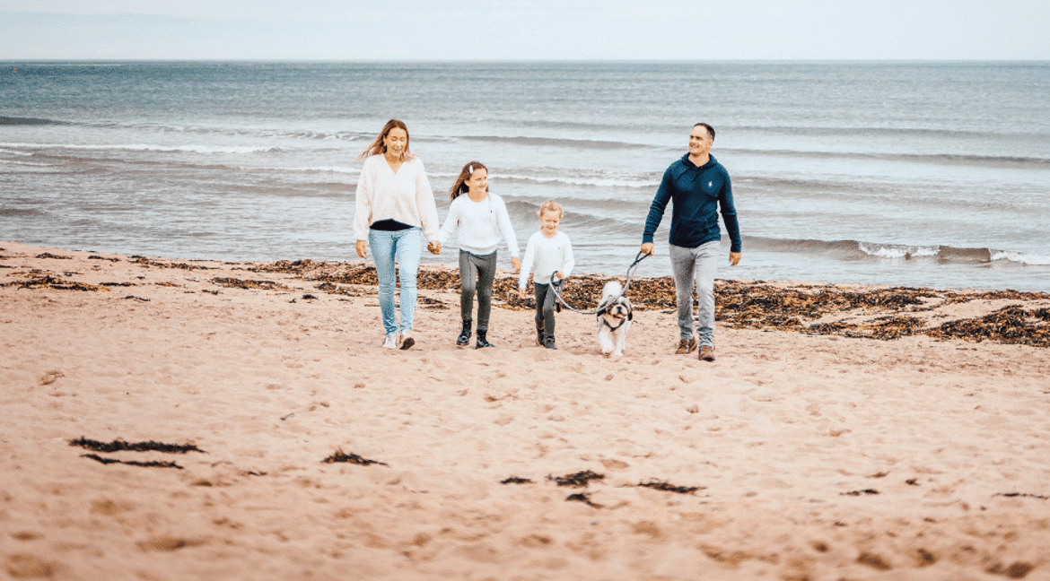 Family and dog on pease bay beach