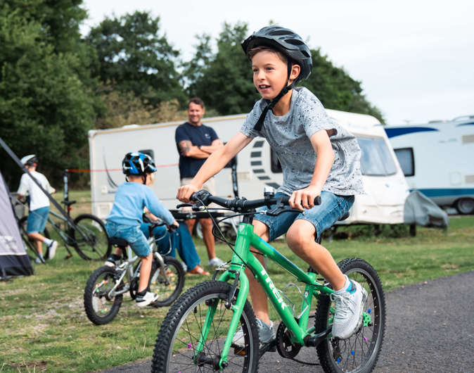 Child on bike in touring field