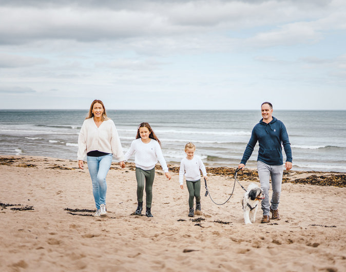 Coldingham Bay beach family with dog